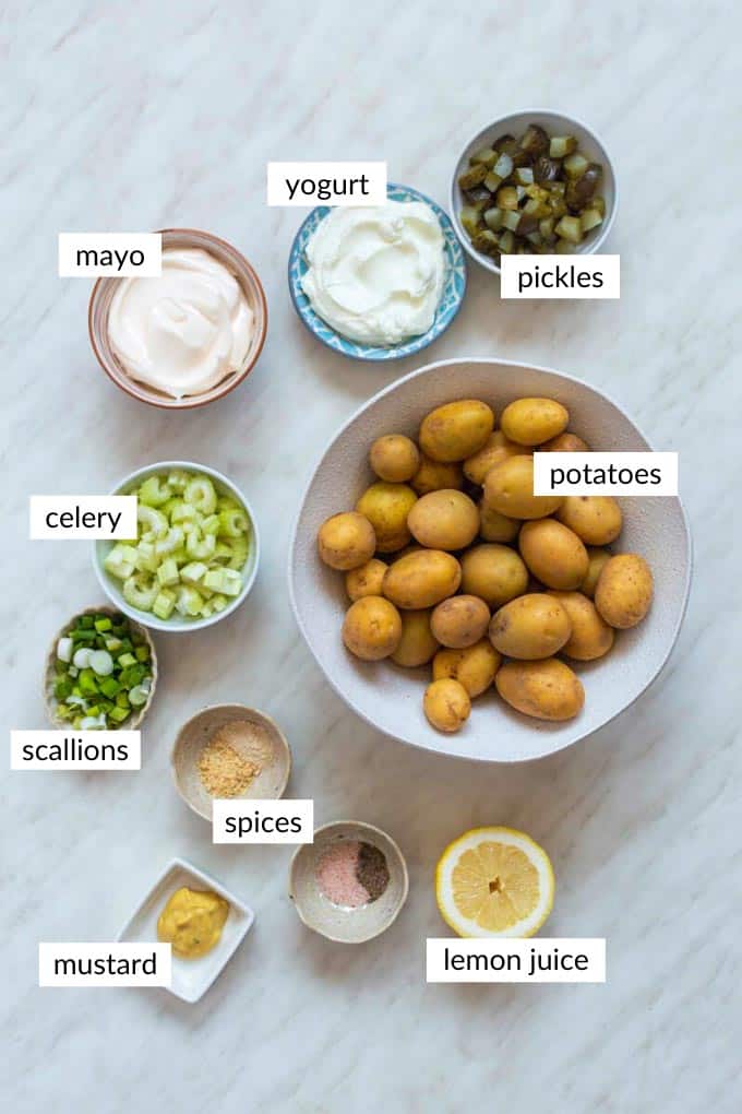 Gathered ingredients for potato salad without eggs with text overlay on each ingredient.