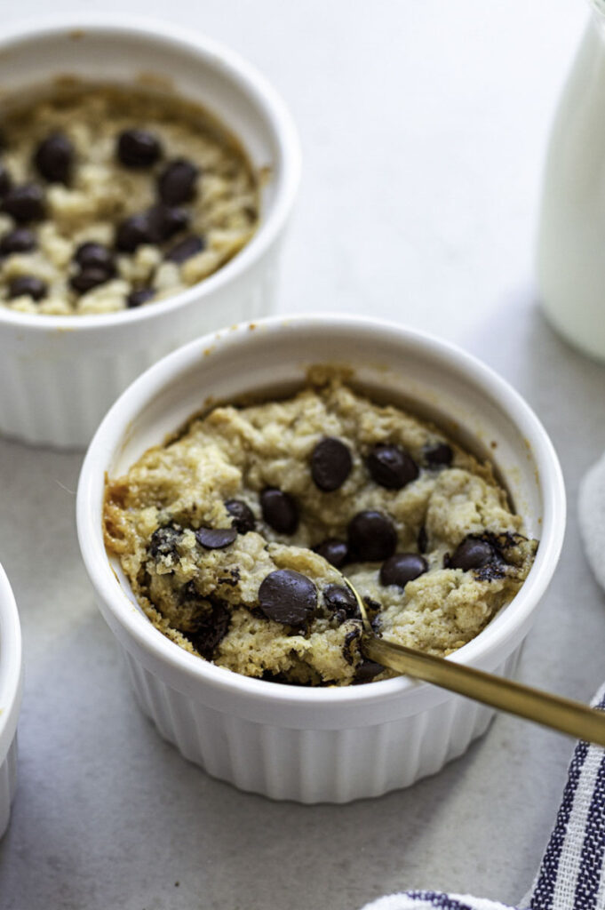 Holding a spoonful of mug cookie.