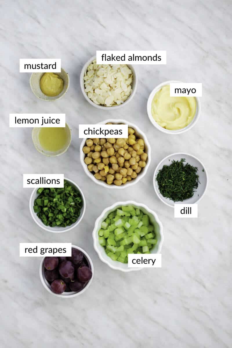 Gathered ingredients for making vegan chicken salad with text overlay on each ingredient.