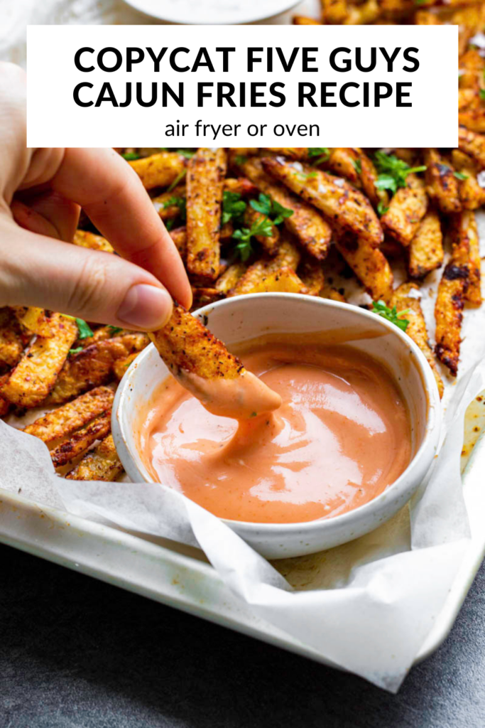A photo of cajun fries with text overlay "Copycat Five Guys Cajun Fries".