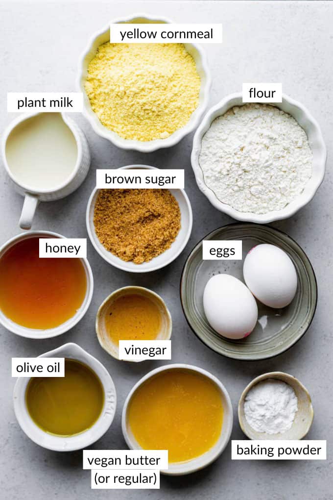 Gathered ingredients for making cornbread without buttermilk with text overlay on each ingredient.