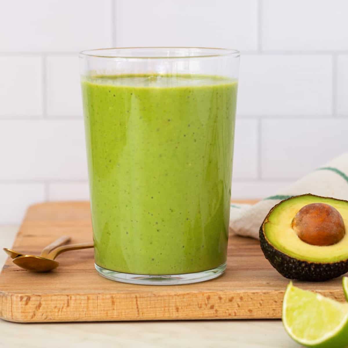 Blender, smoothie and healthy black woman taste juice for green