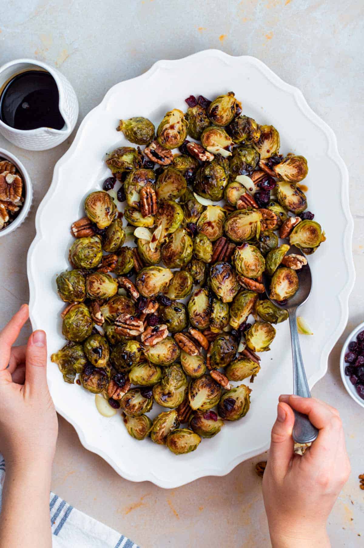 Roasted frozen Brussels sprouts served on a white plate.