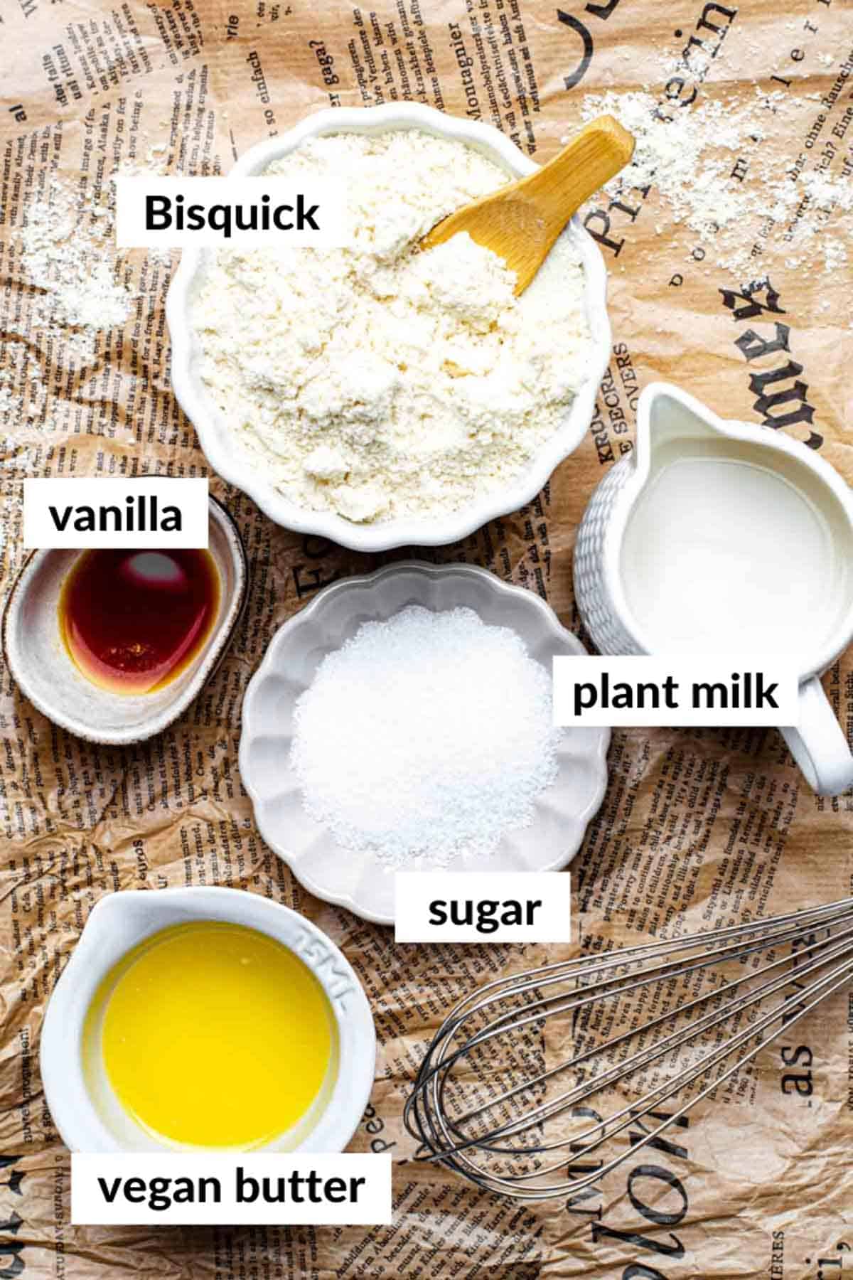 Gathered ingredients for making vegan Bisquick pancakes with text overlay on each ingredient.