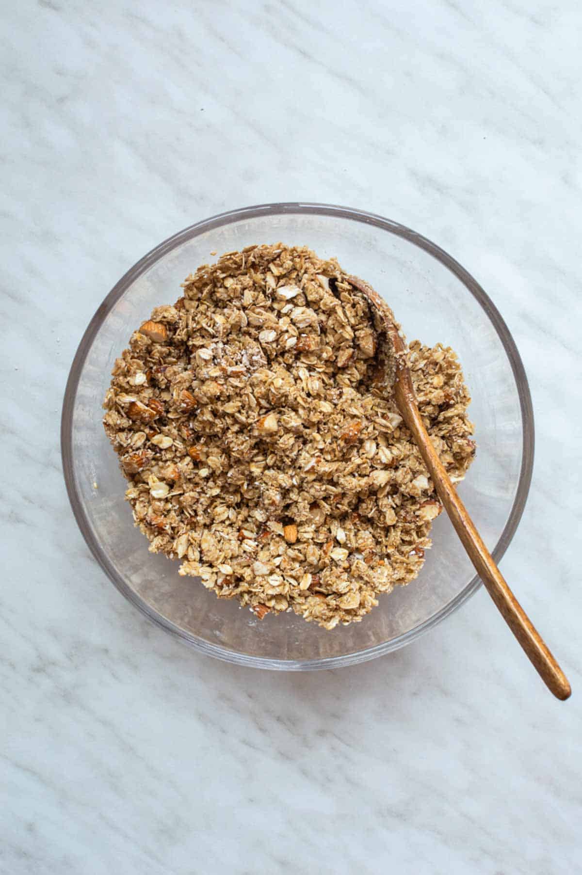 Oat topping mixed in a large glass bowl.