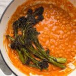 Chickpeas in a sun-dried tomato sauce topped with roasted broccolini.