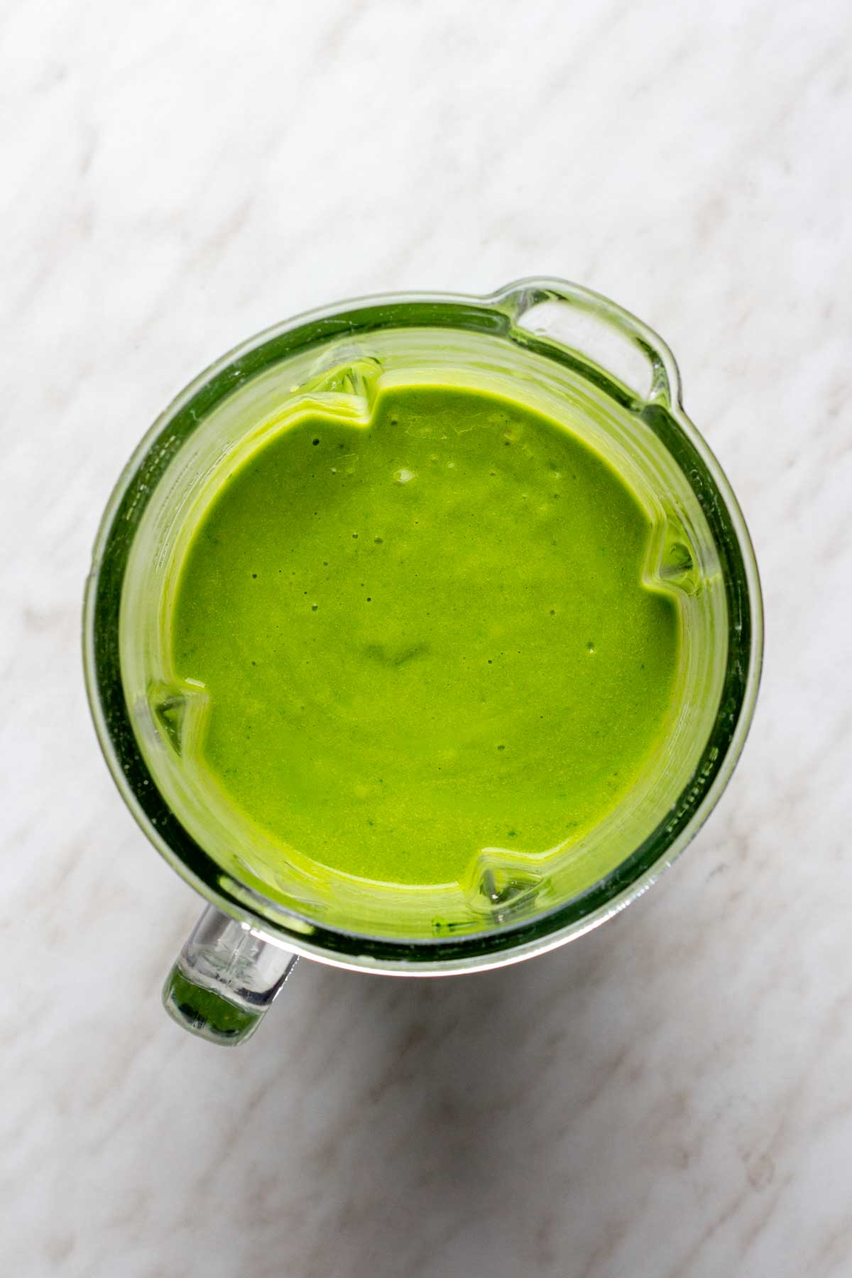 Avocado smoothie in the blender jar after blending. 